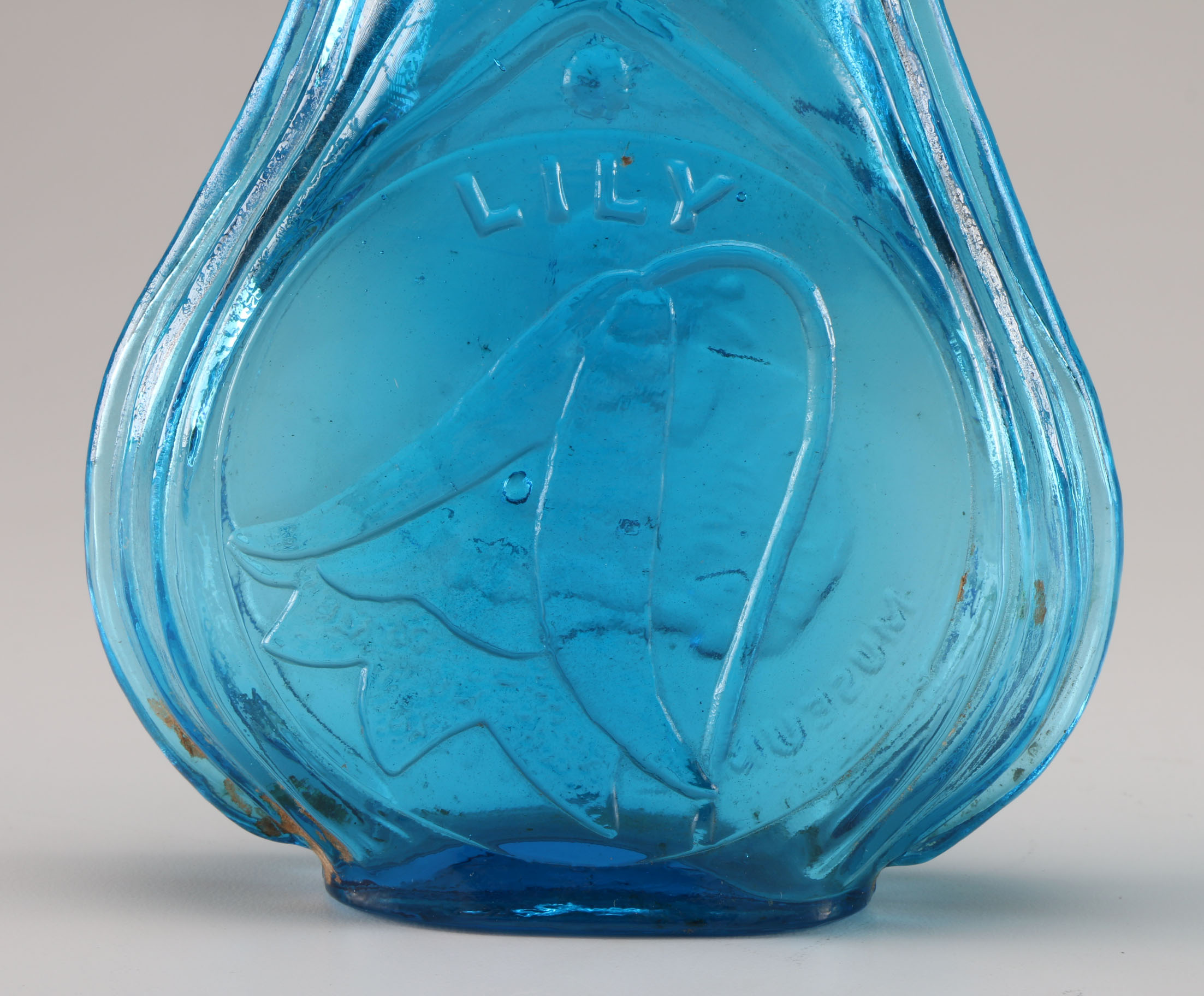 Assortment of Clevenger Brothers Colored Glass Bottles