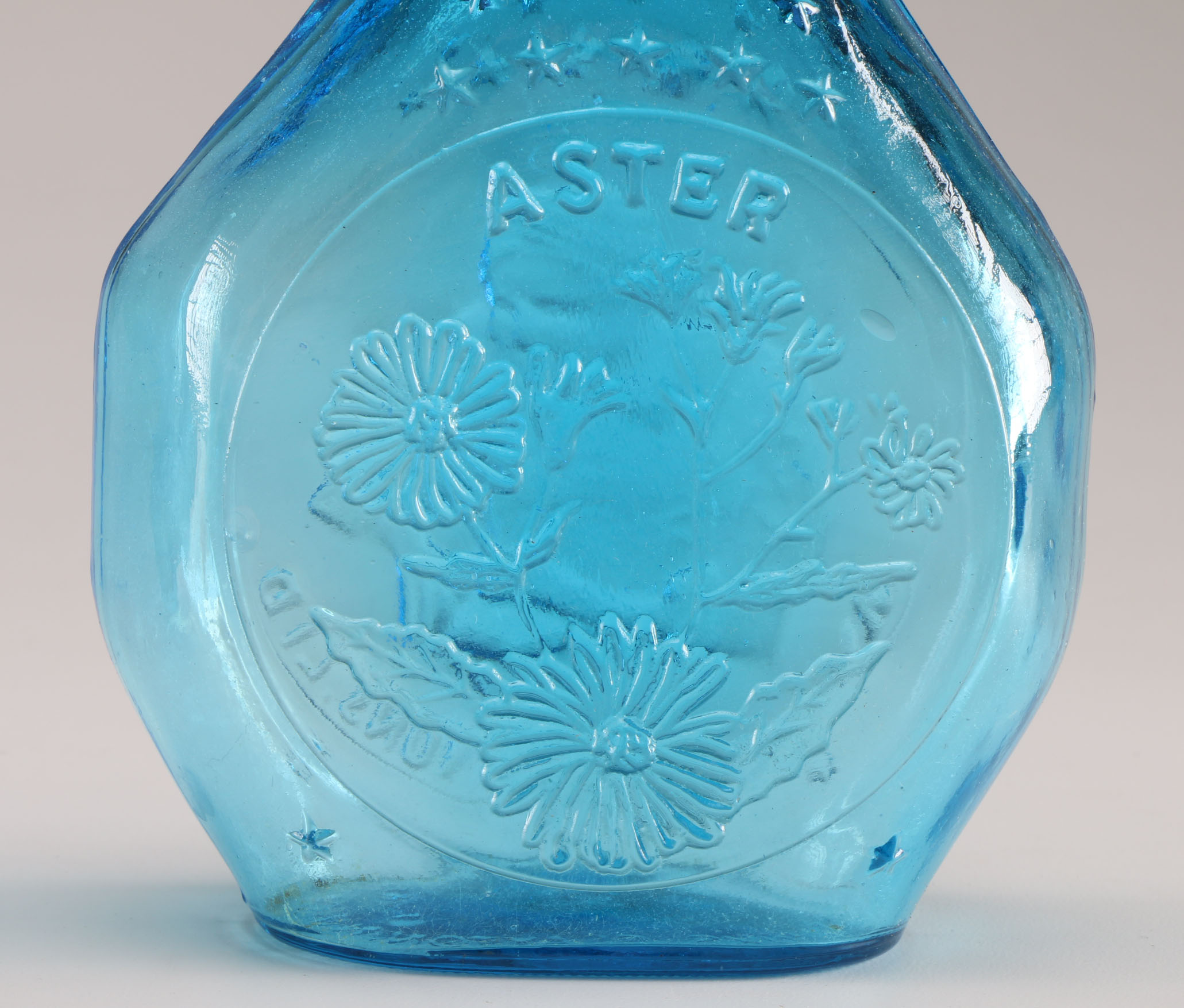 Assortment of Clevenger Brothers Colored Glass Bottles