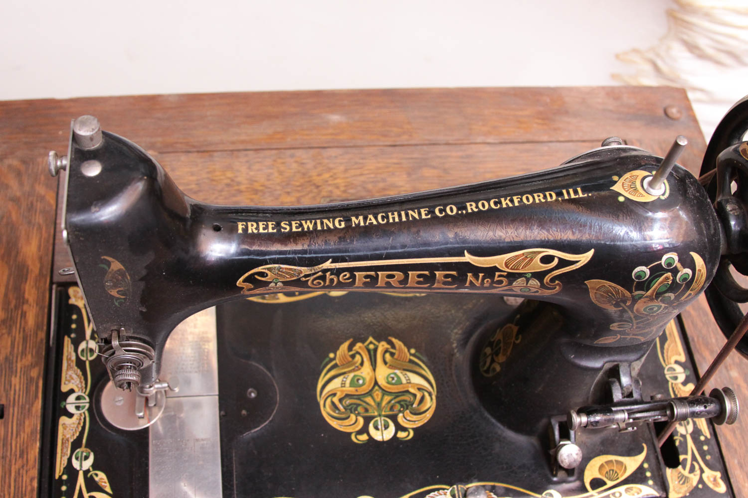 Antique Sewing Machine in Oak Cabinet by Free Co.