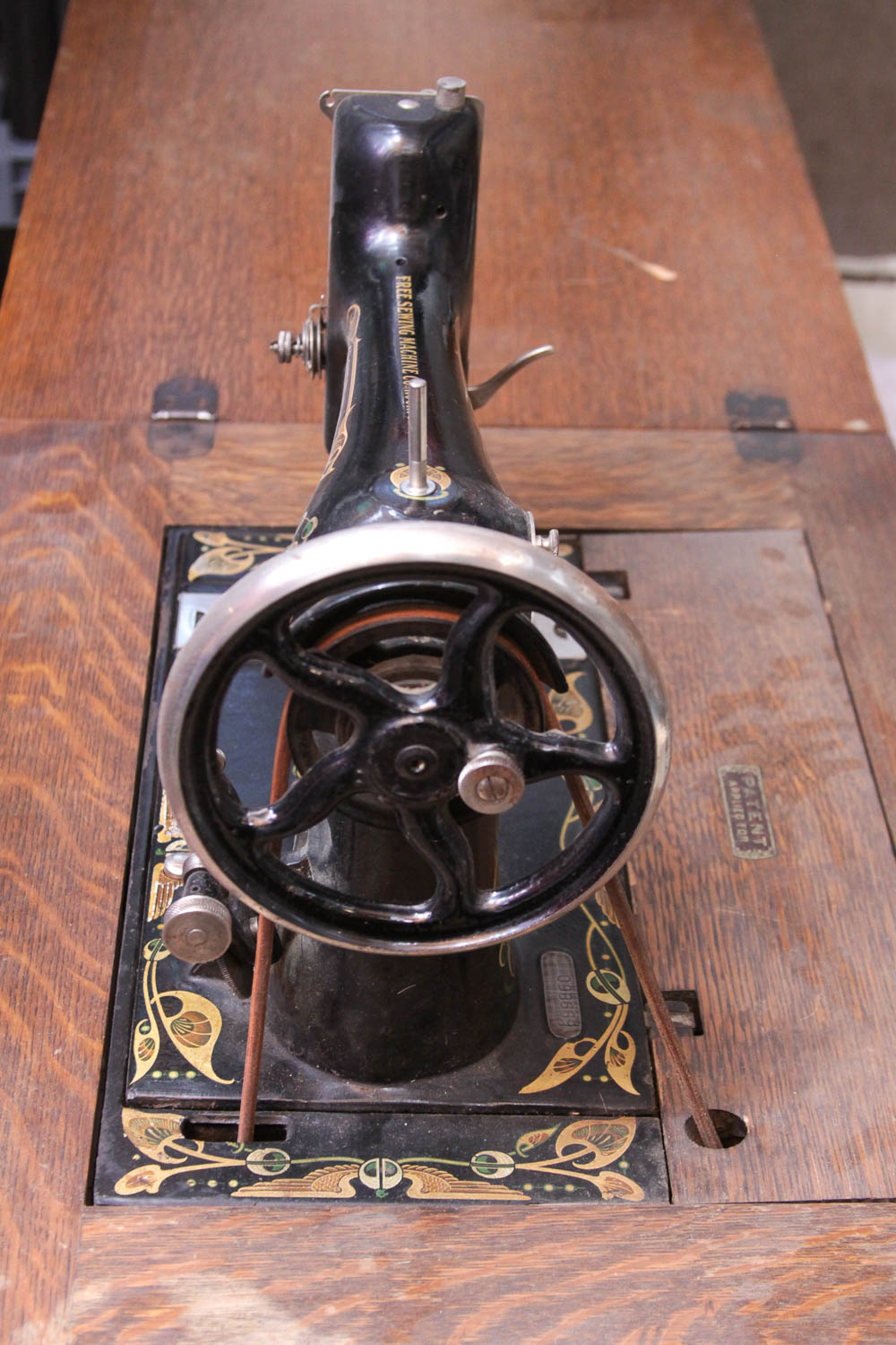 Antique Sewing Machine in Oak Cabinet by Free Co.