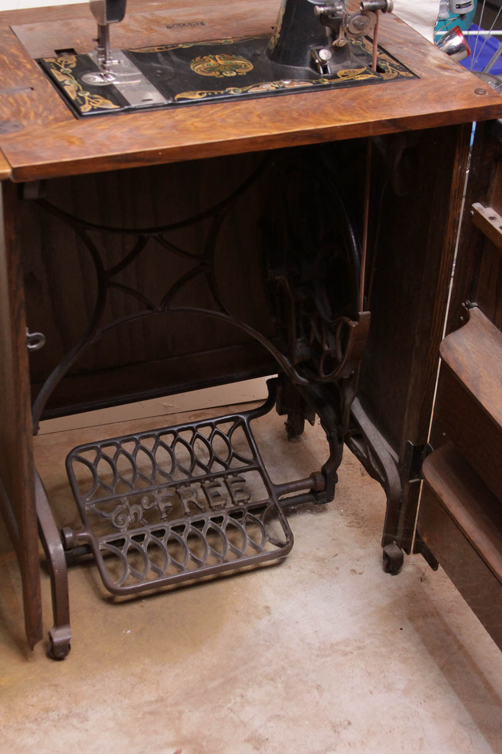 Antique Sewing Machine in Oak Cabinet by Free Co.