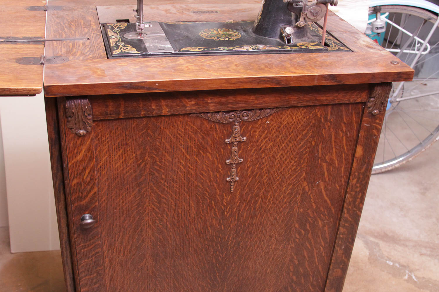 Antique Sewing Machine in Oak Cabinet by Free Co.