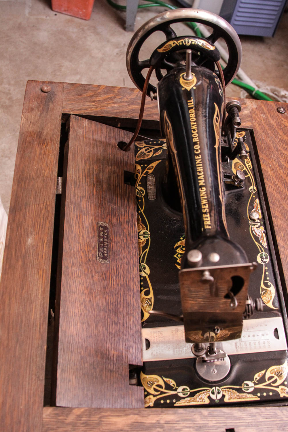 Antique Sewing Machine in Oak Cabinet by Free Co.