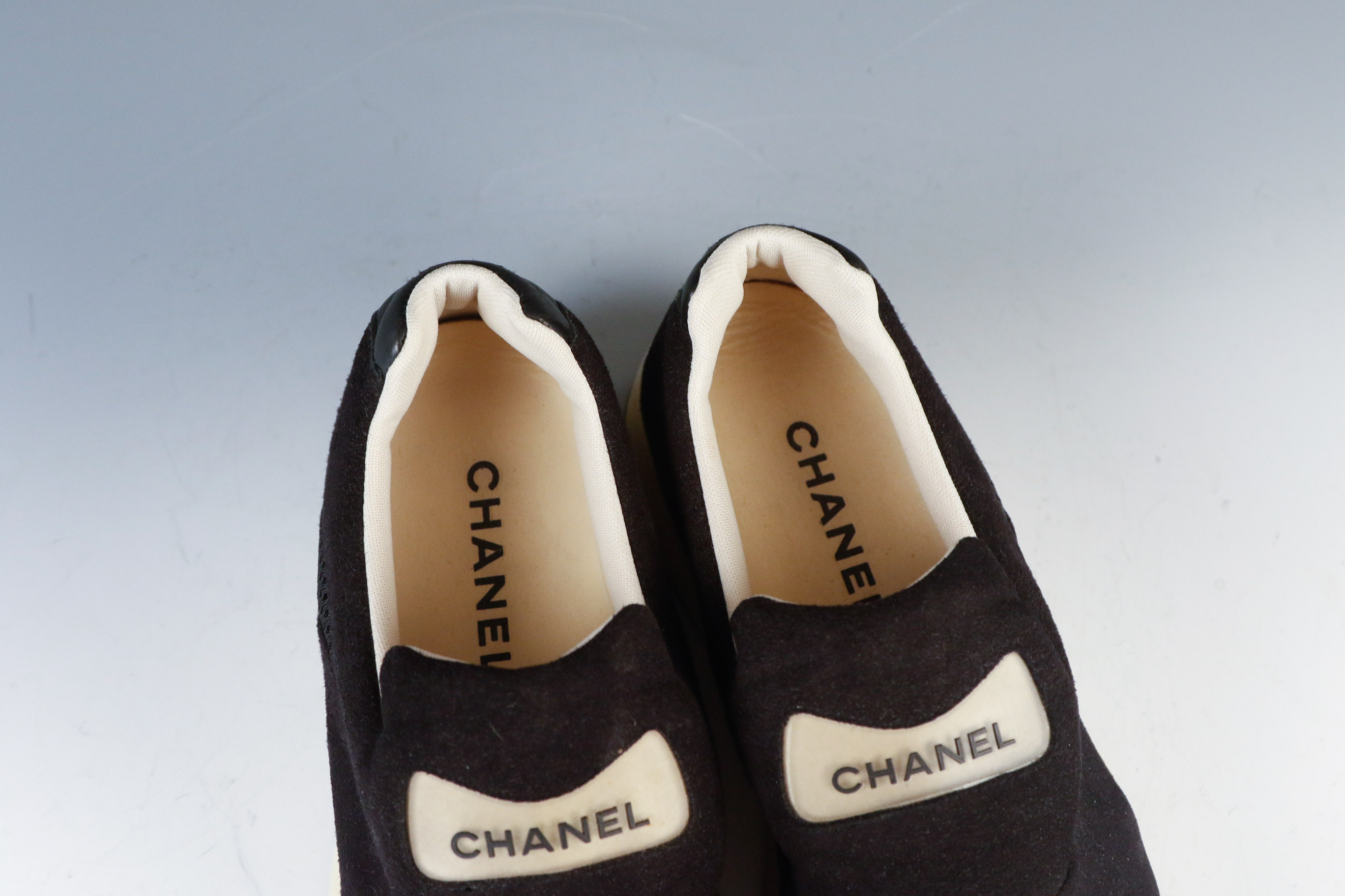 Women's Chanel Black Leather Slip-On Athletic Sneakers