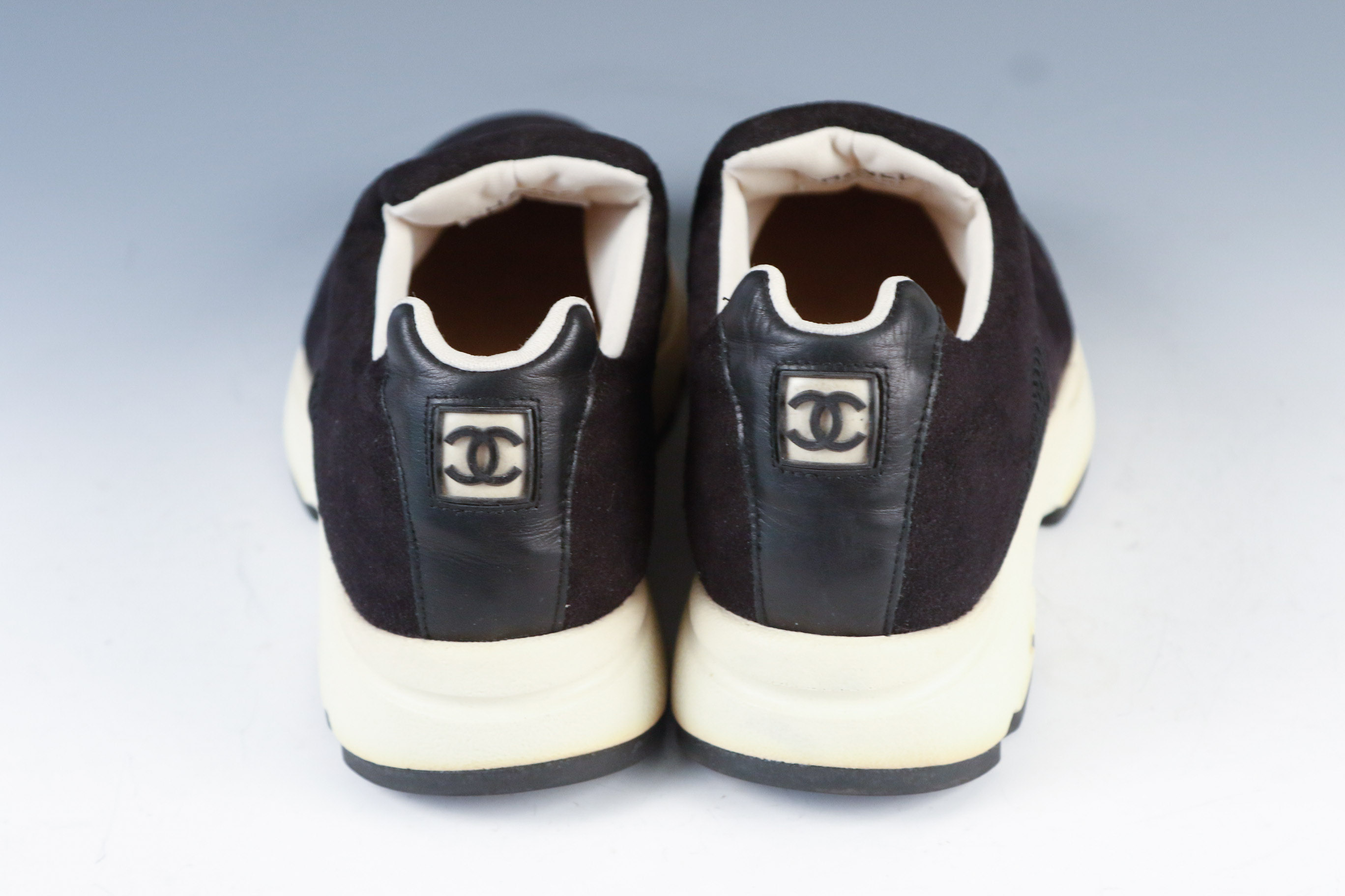 Women's Chanel Black Leather Slip-On Athletic Sneakers