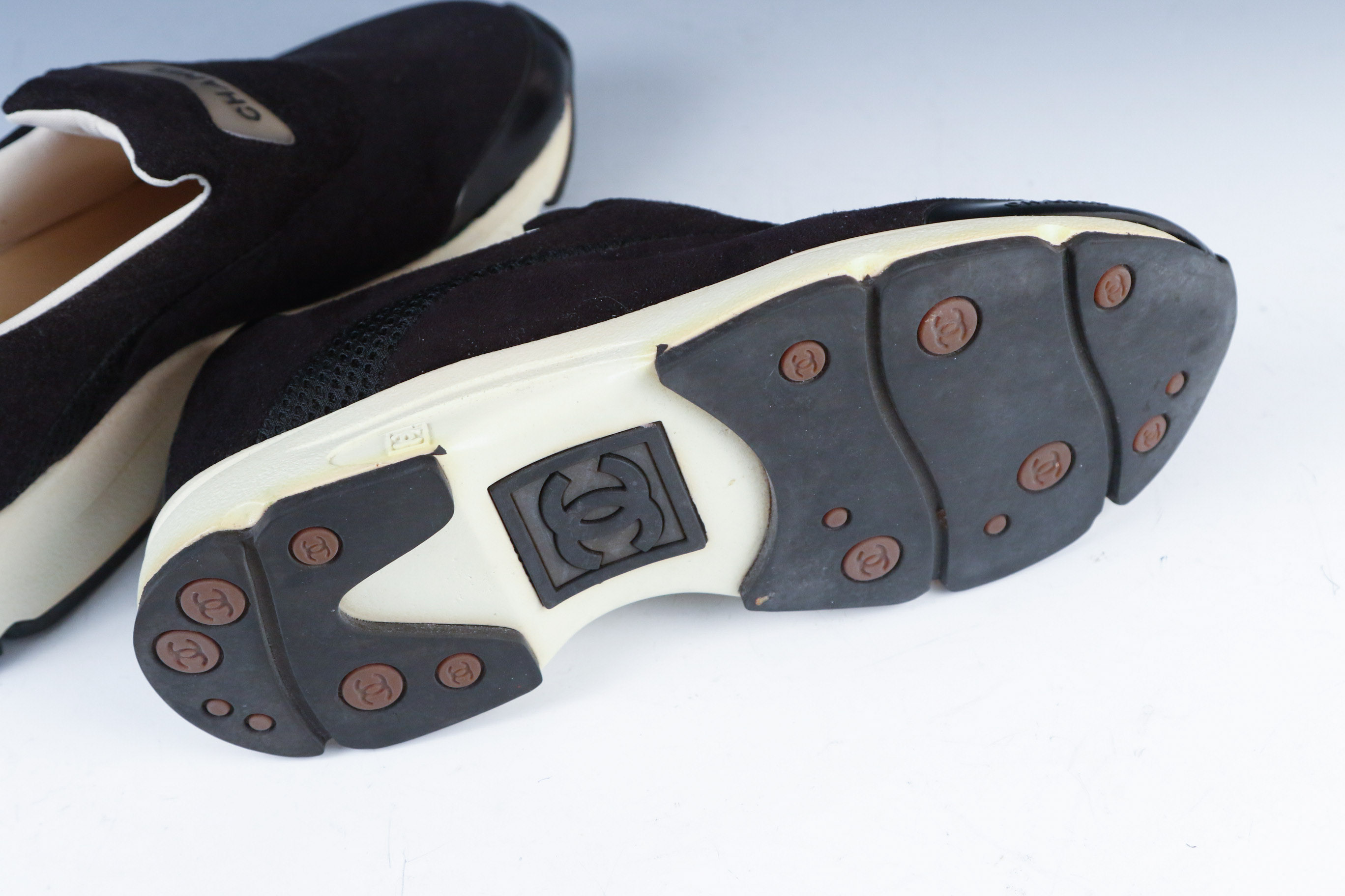 Women's Chanel Black Leather Slip-On Athletic Sneakers