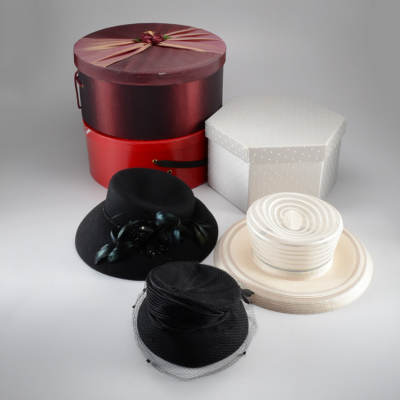 Three Women's Hats in Boxes