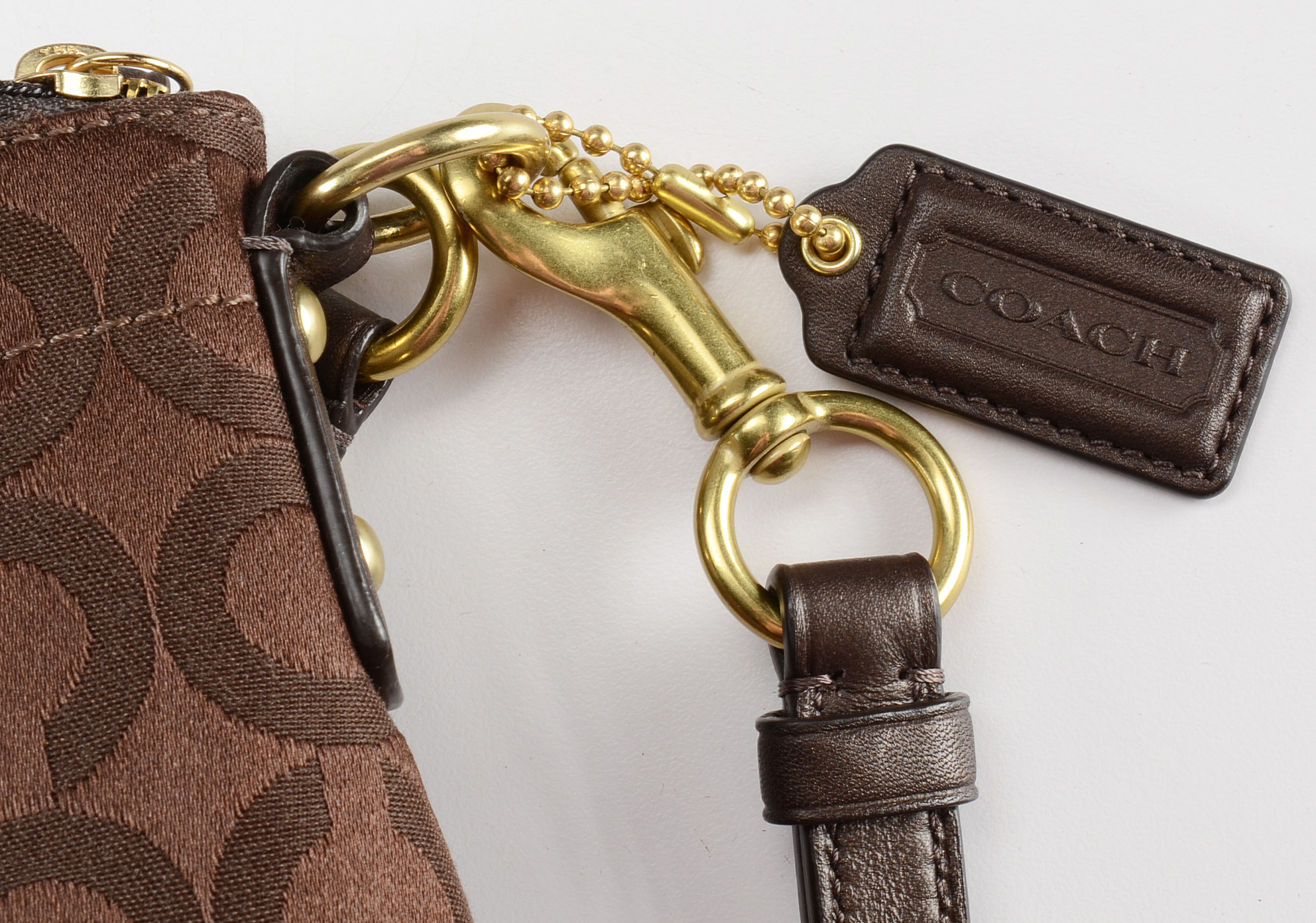 Three Coach Signature Handbags