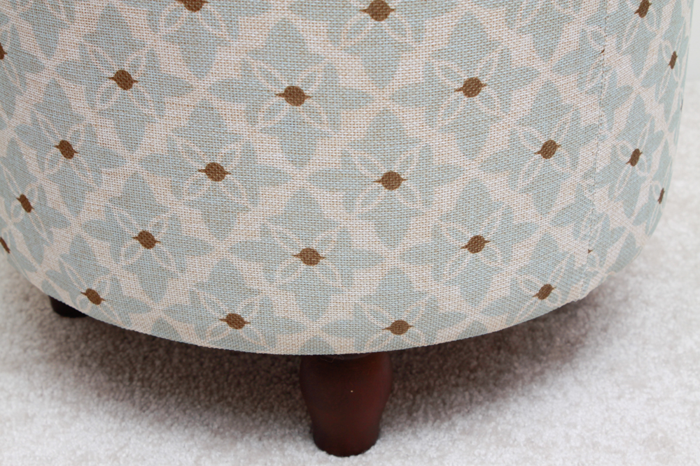 Round Upholstered Privilege Ottoman