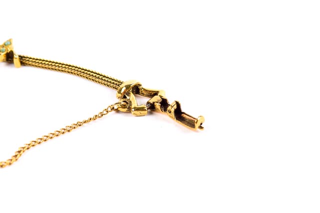 Gold Tone Bracelet With Burgundy and Green Stones