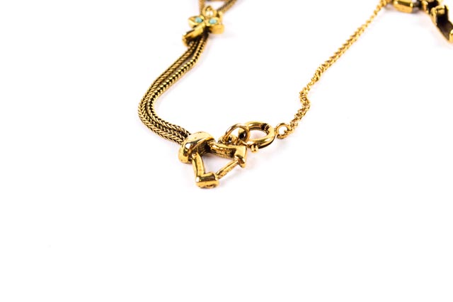 Gold Tone Bracelet With Burgundy and Green Stones