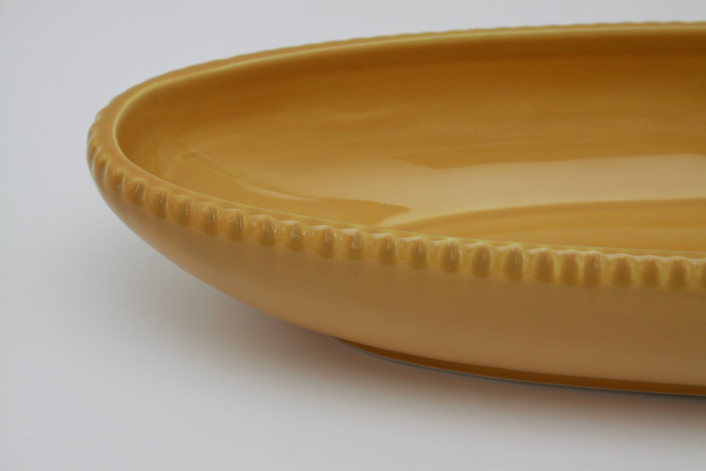 Collection of Colorful Ceramic Bakeware and Plates