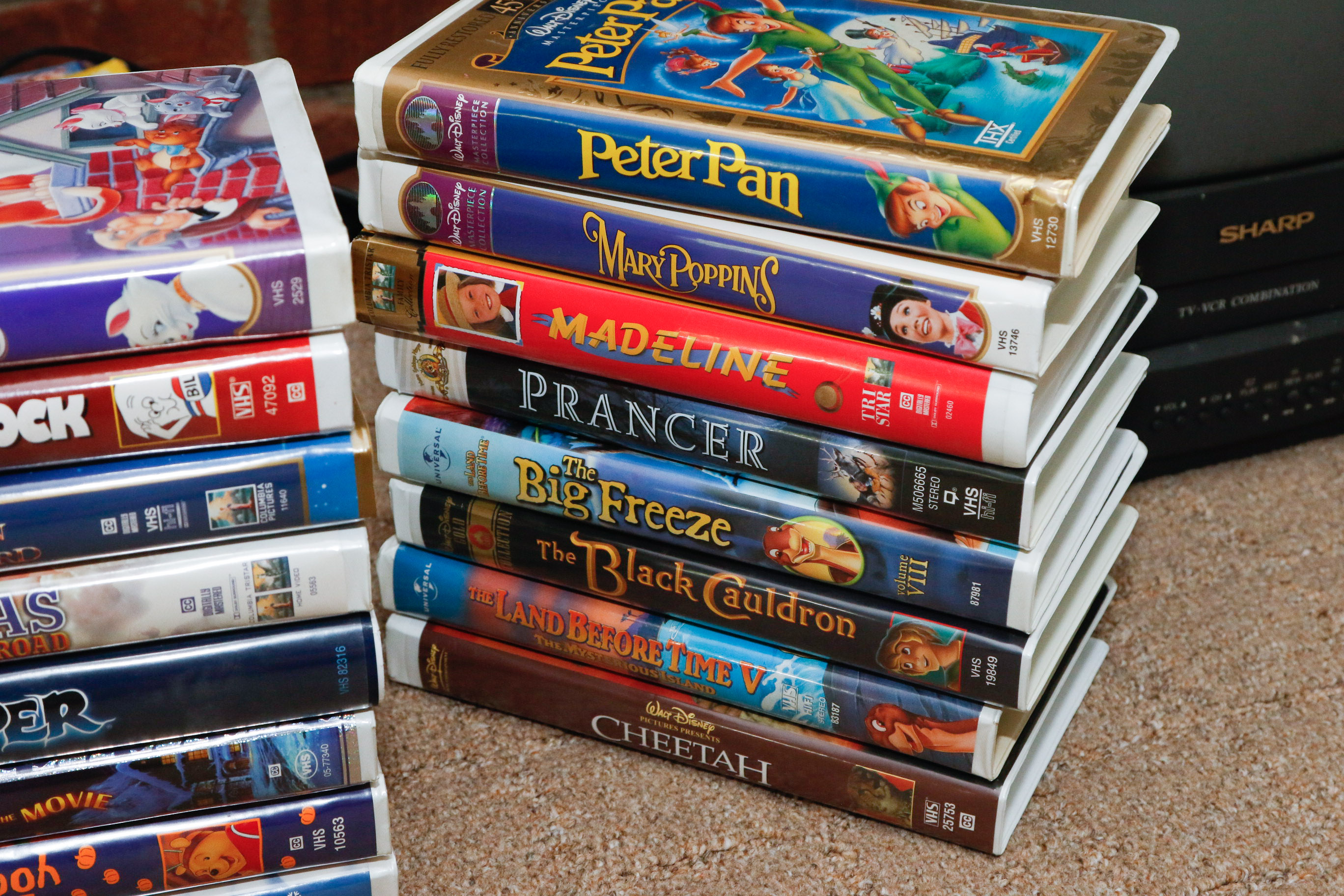 Disney VHS Collection with VHS/DVD Converter and Television