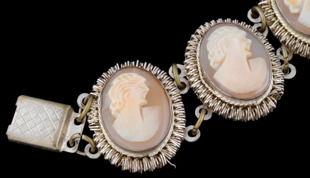 Early 20th Century 800 Silver Filigree and Hand Carved Cameo Shell Openwork Brooch and a Carved Cameo Link Bracelet