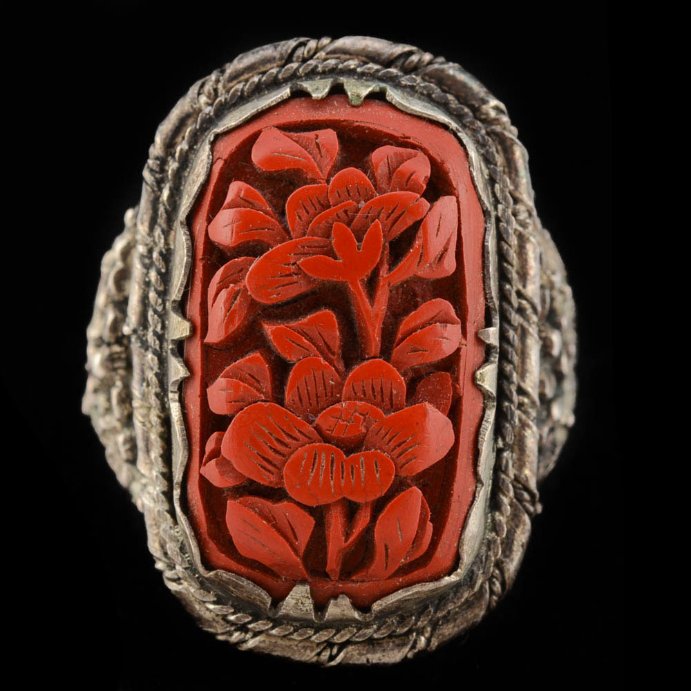 Early 20th Century Chinese Carved Cinnabar and 900 Silver Openwork Ring