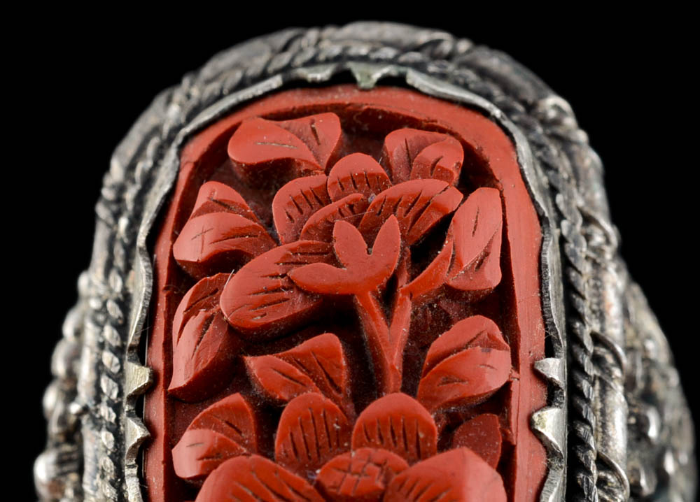 Early 20th Century Chinese Carved Cinnabar and 900 Silver Openwork Ring