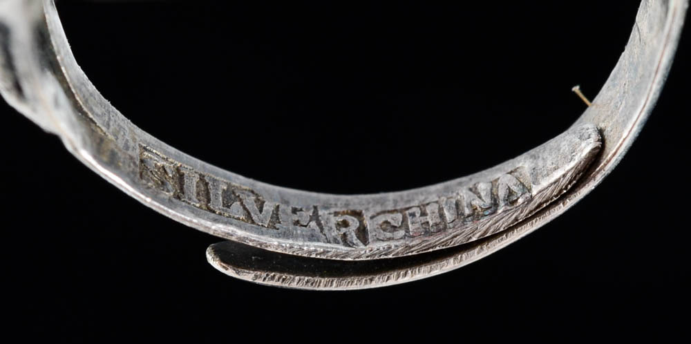 Early 20th Century Chinese Carved Cinnabar and 900 Silver Openwork Ring