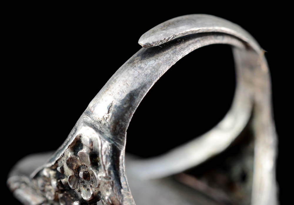 Early 20th Century Chinese Carved Cinnabar and 900 Silver Openwork Ring