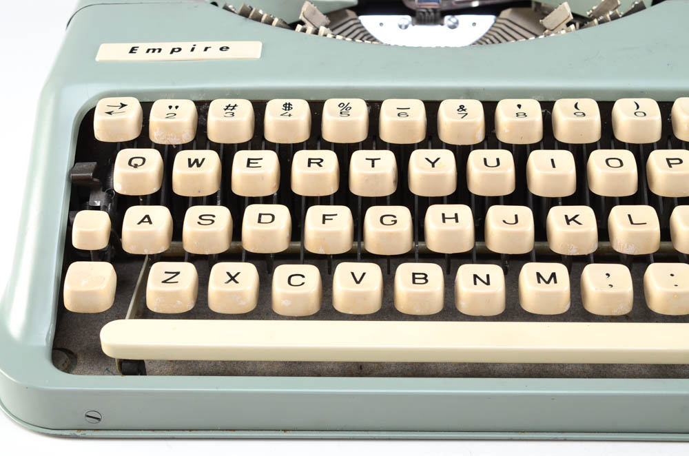 A Vintage "Empire" Typewriter and Drafting Tool Kits