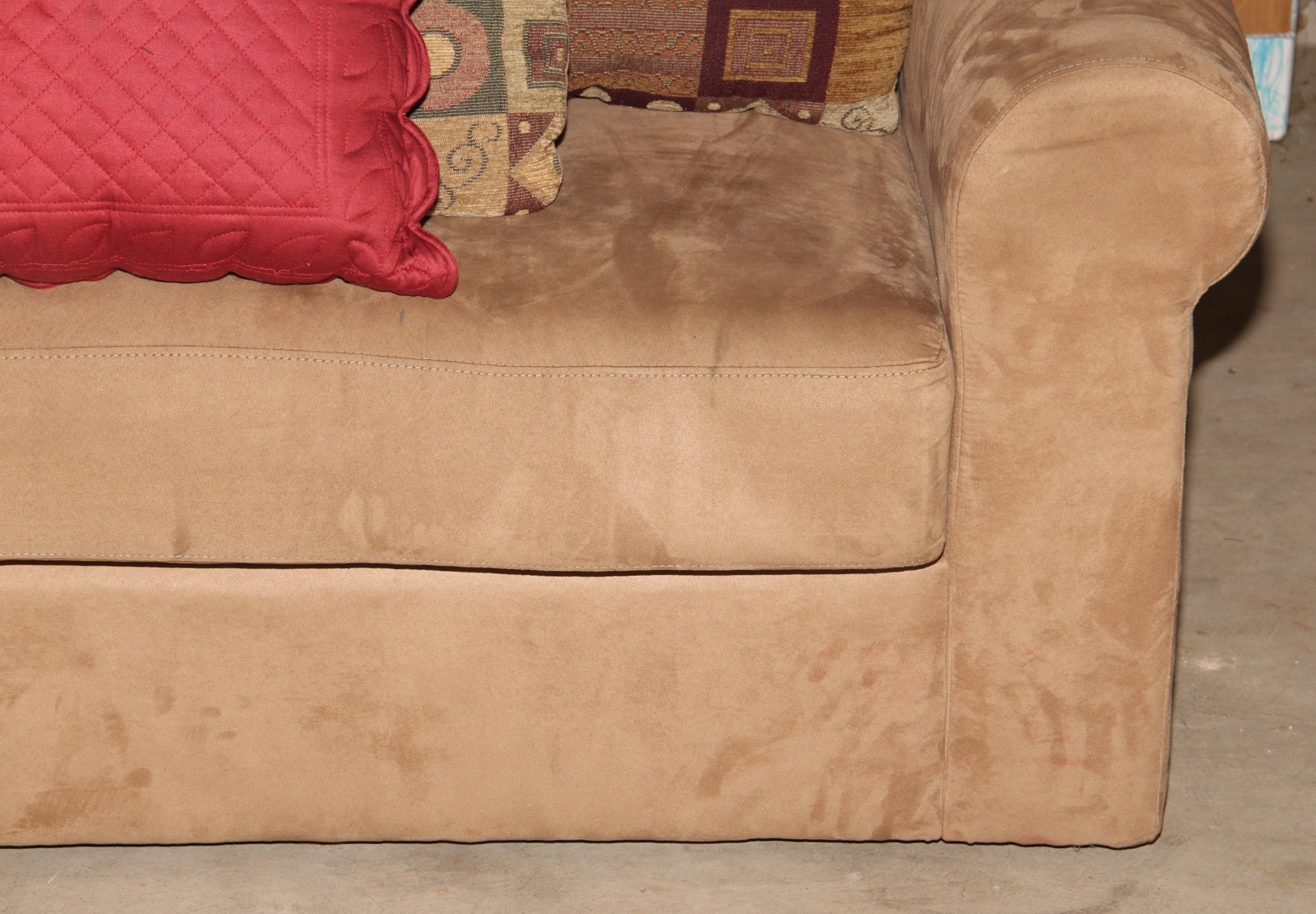 Beige Loveseat and Decorative Throw Pillows