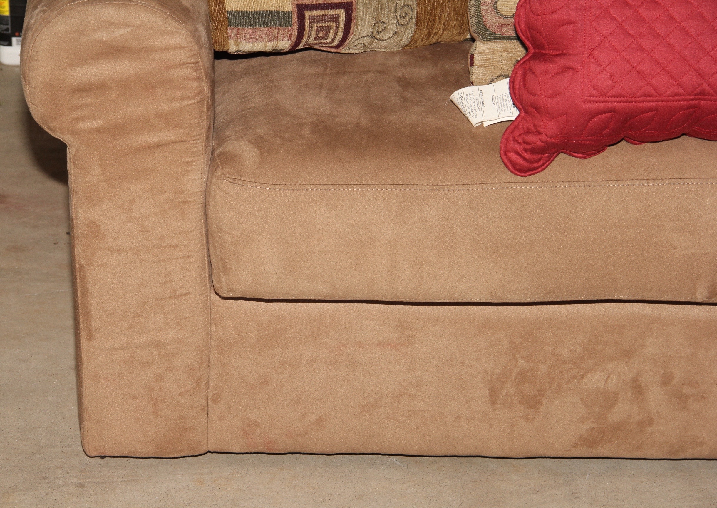 Beige Loveseat and Decorative Throw Pillows