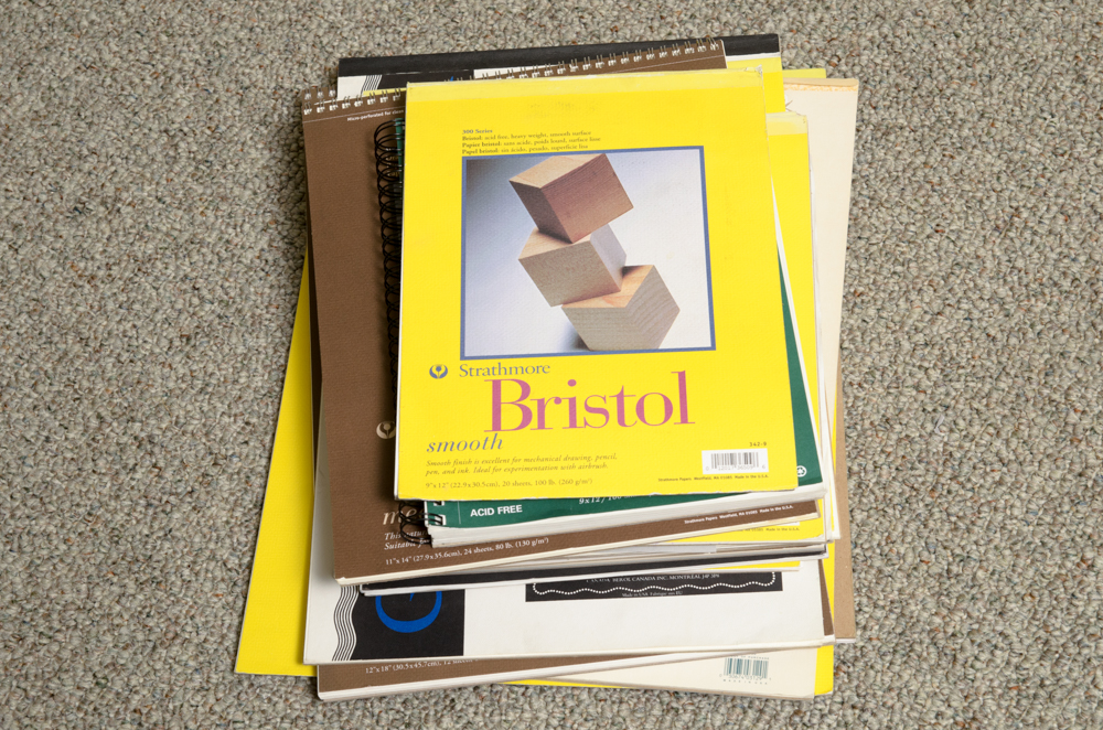 Collection of Art Supplies and Paper