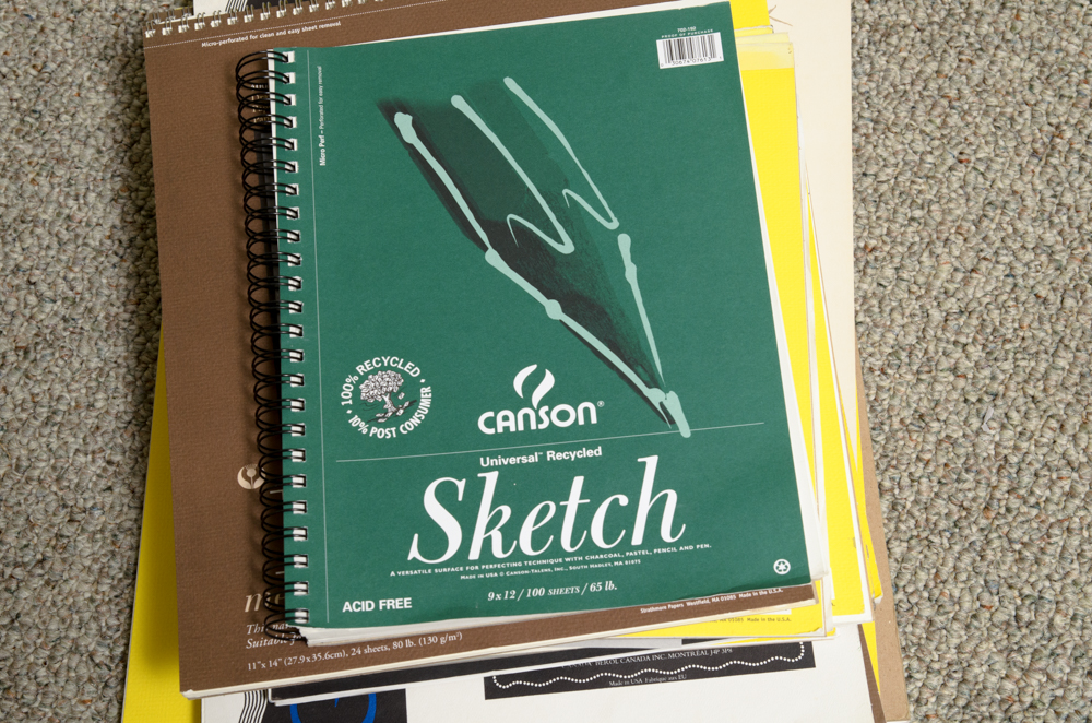 Collection of Art Supplies and Paper