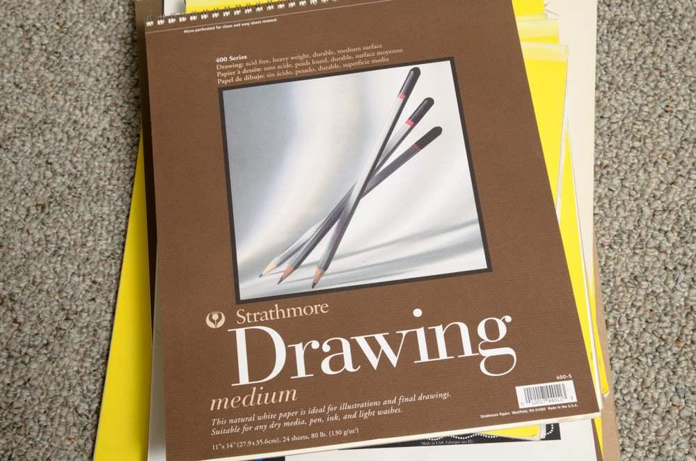 Collection of Art Supplies and Paper