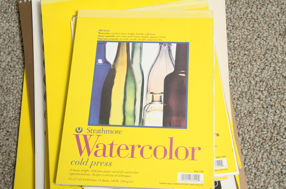 Collection of Art Supplies and Paper