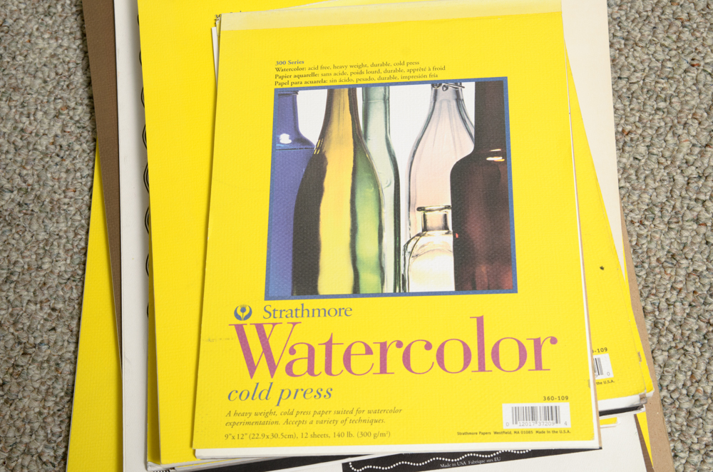 Collection of Art Supplies and Paper