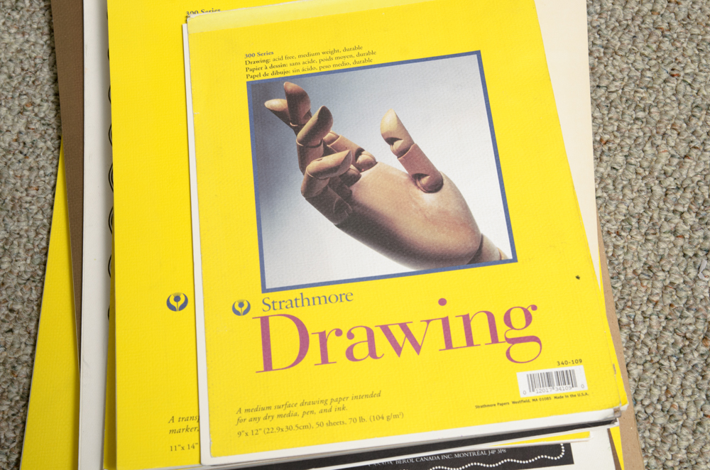 Collection of Art Supplies and Paper