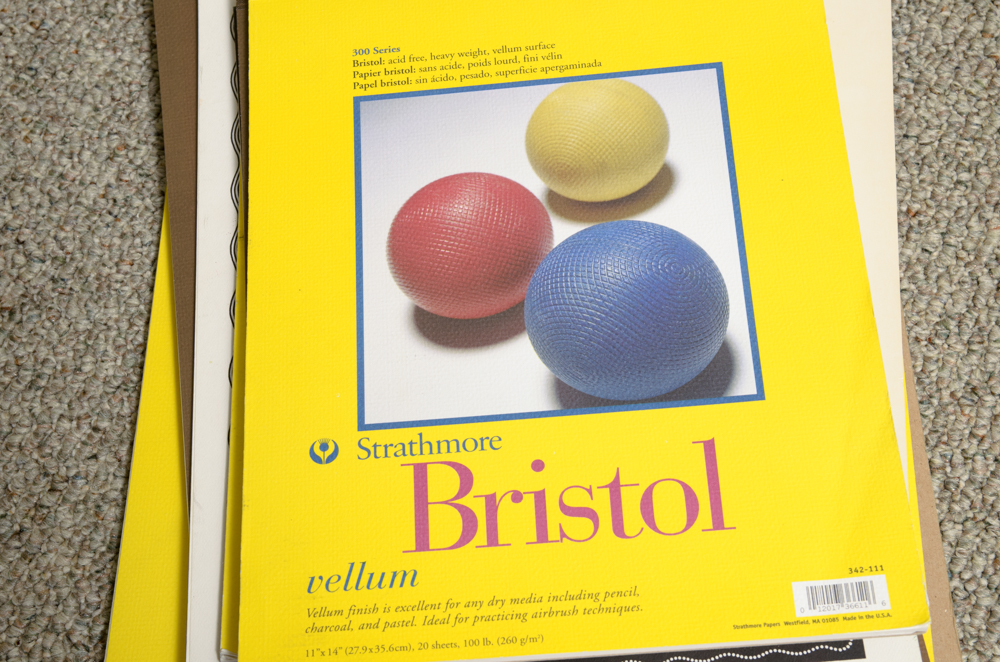 Collection of Art Supplies and Paper