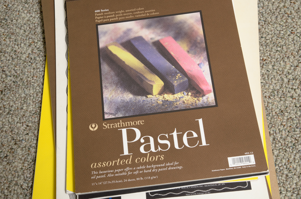 Collection of Art Supplies and Paper