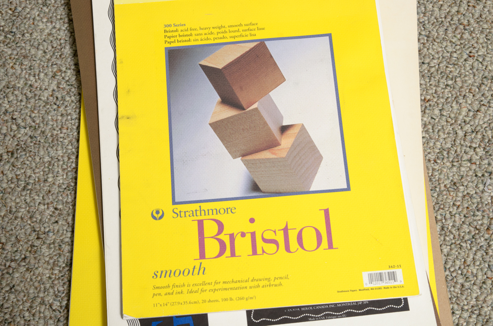 Collection of Art Supplies and Paper