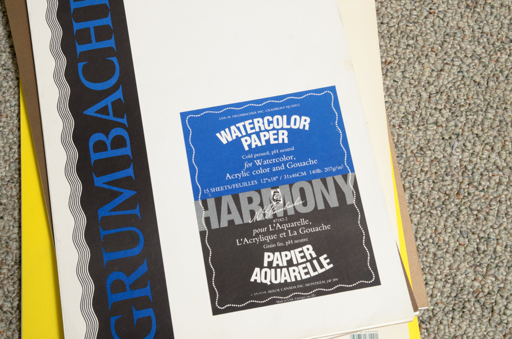 Collection of Art Supplies and Paper