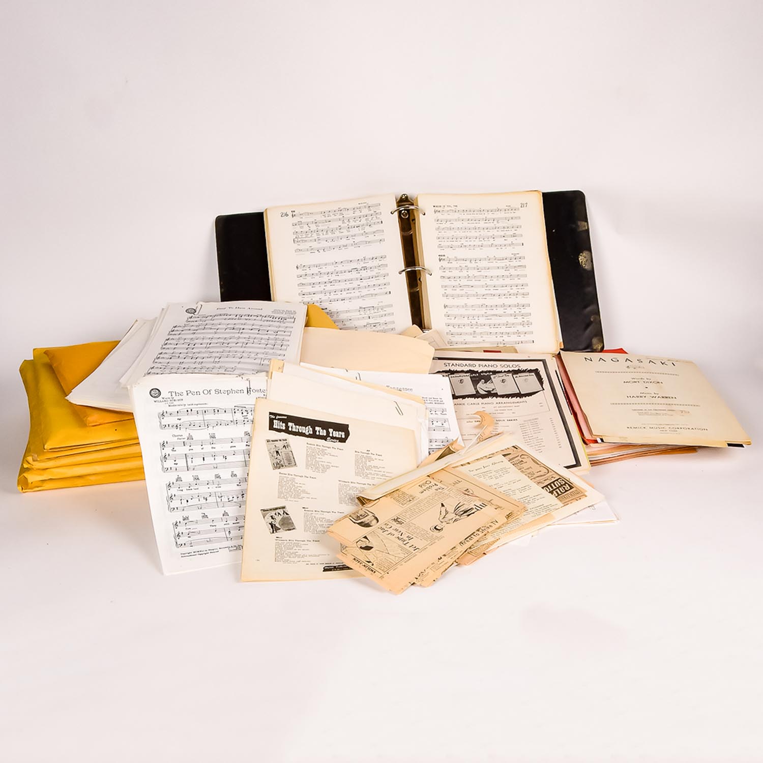 Collection of Vintage Sheet Music and Newspaper Clippings