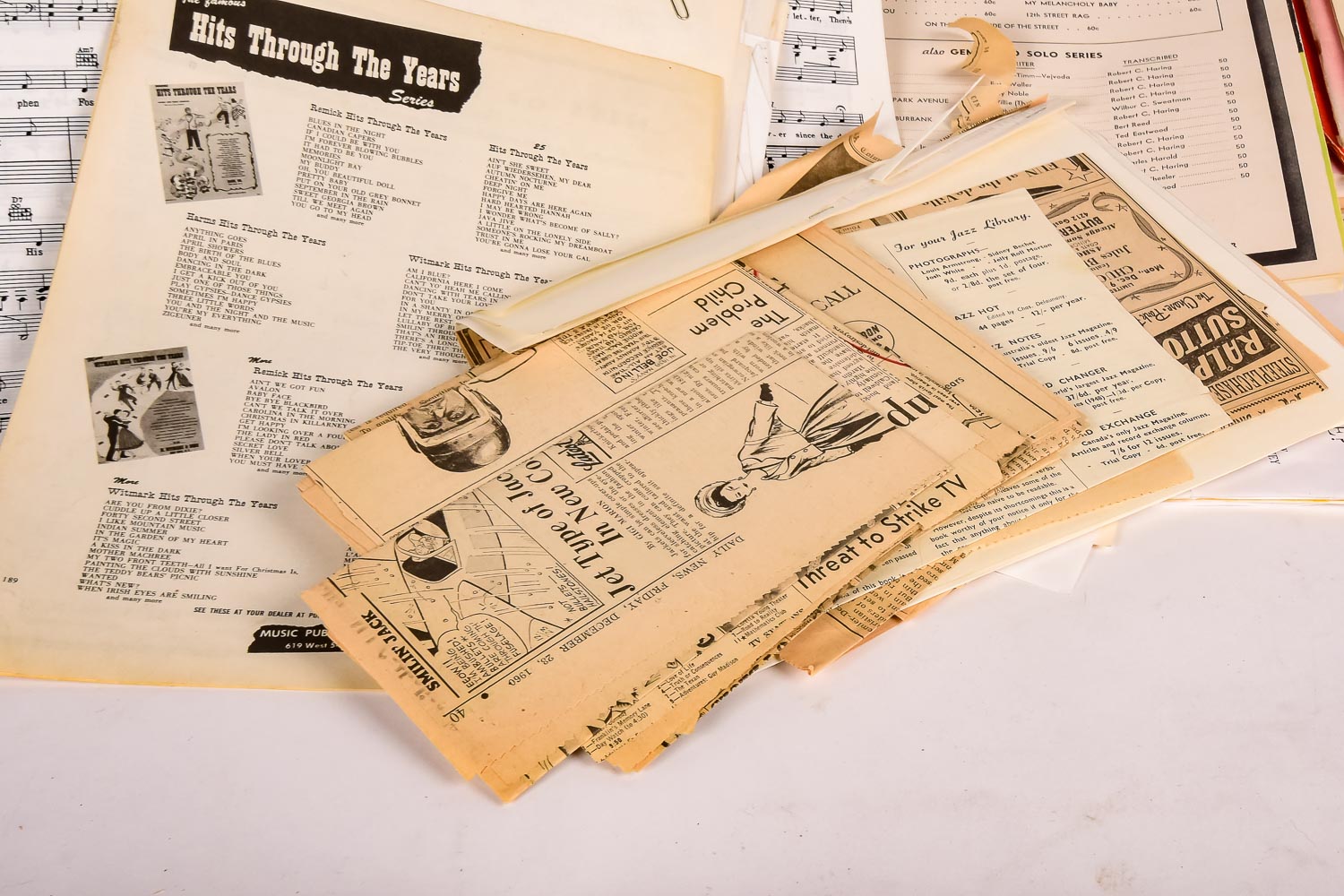 Collection of Vintage Sheet Music and Newspaper Clippings