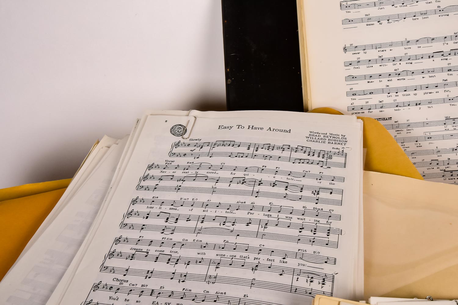 Collection of Vintage Sheet Music and Newspaper Clippings