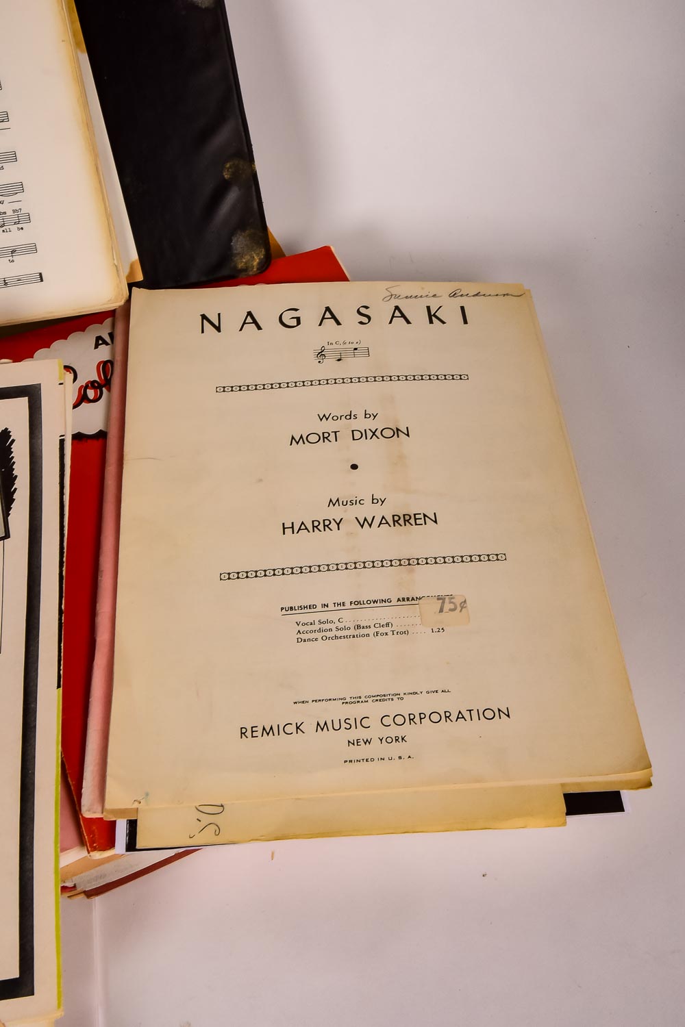 Collection of Vintage Sheet Music and Newspaper Clippings