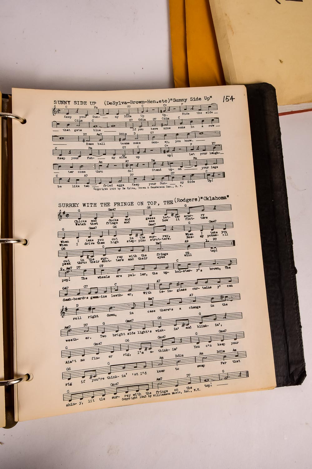 Collection of Vintage Sheet Music and Newspaper Clippings