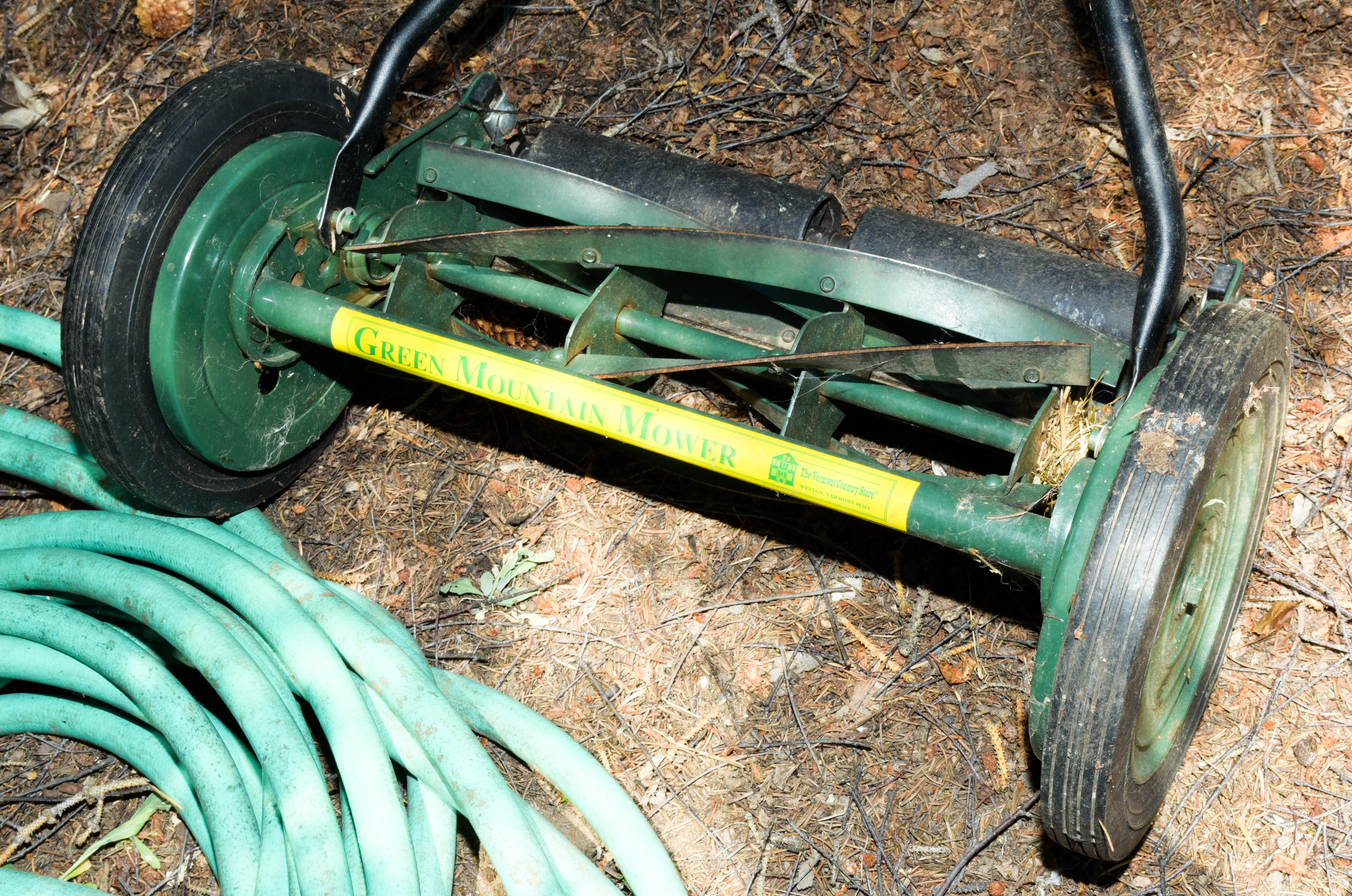 Green Push Mower and Yard Hose