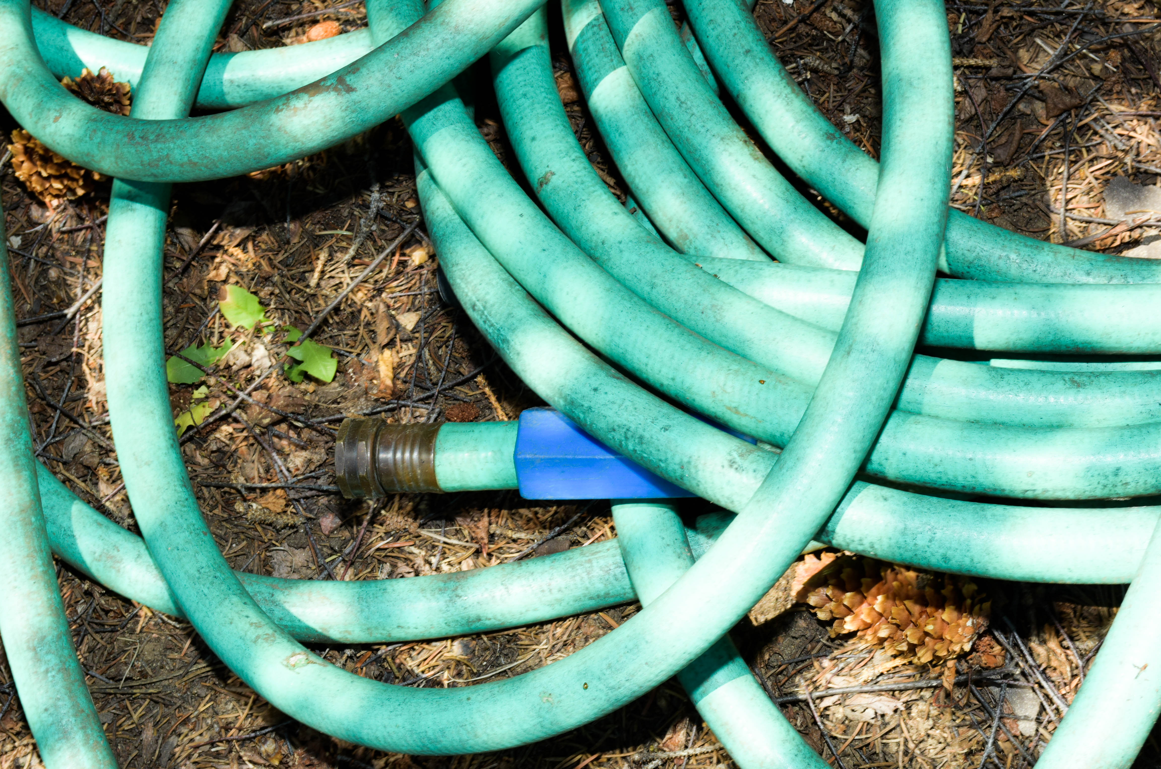 Green Push Mower and Yard Hose