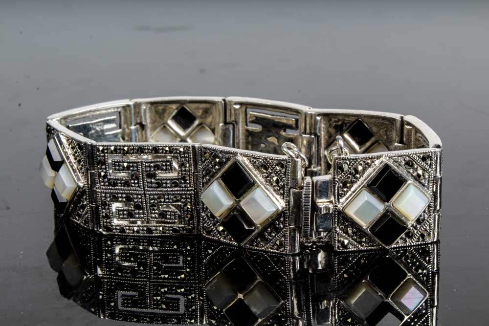 Two Sterling Silver Onyx and Mother of Pearl Bracelets