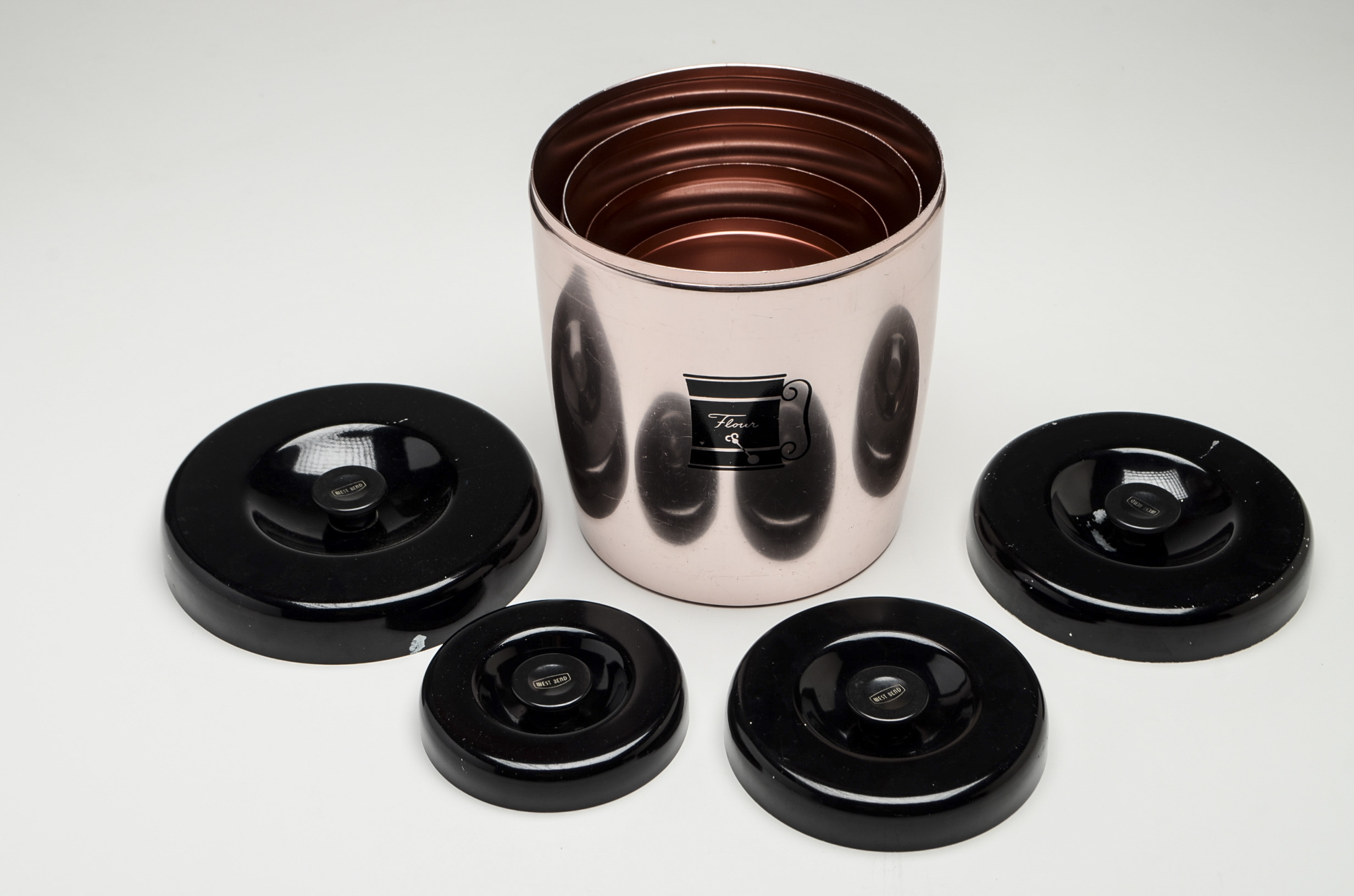 Vintage West Bend Aluminum Four-Piece Nesting Kitchen Canisters