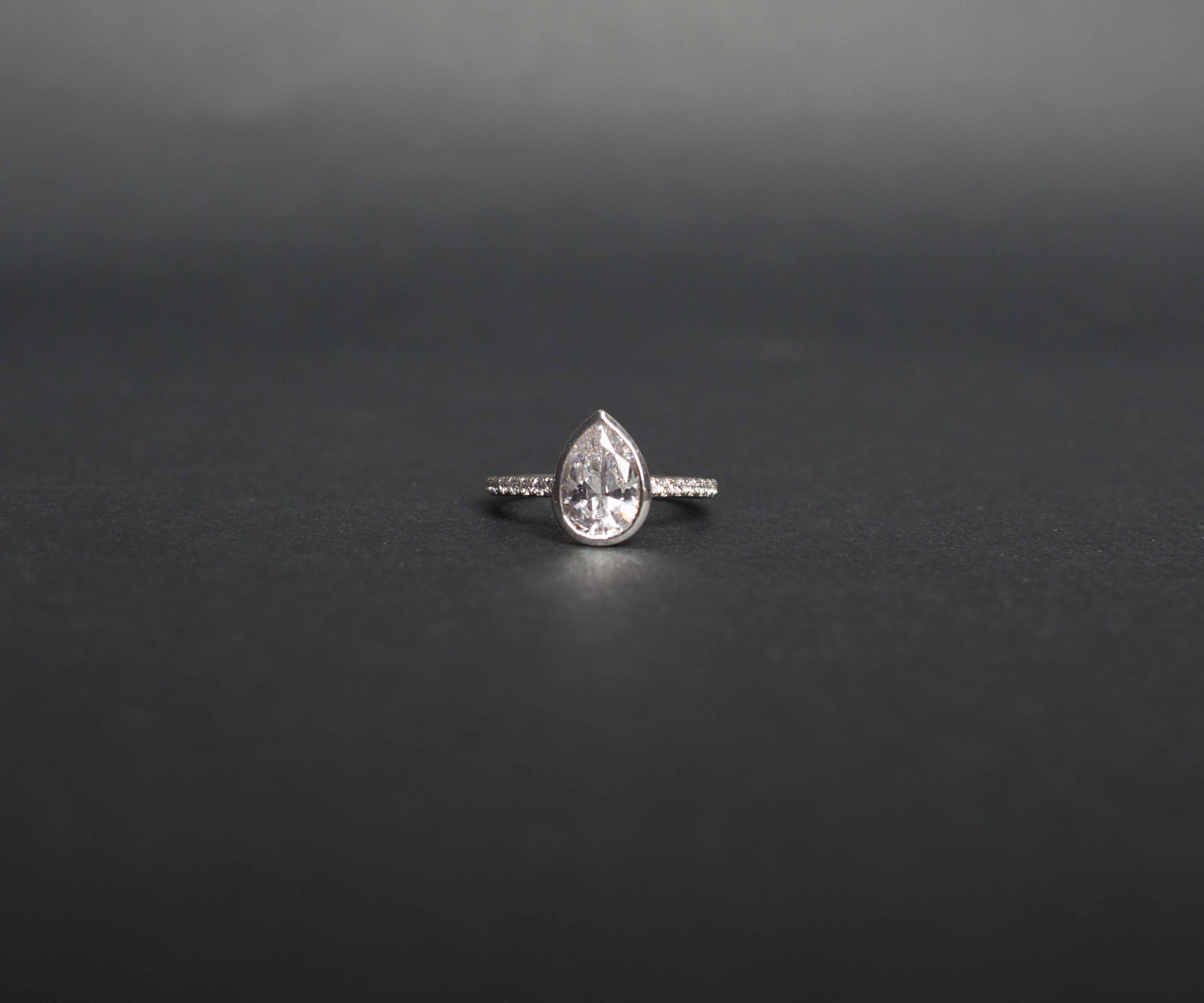 Sterling Silver Cubic Zirconia Channel Set Band and Pear Cut Stone