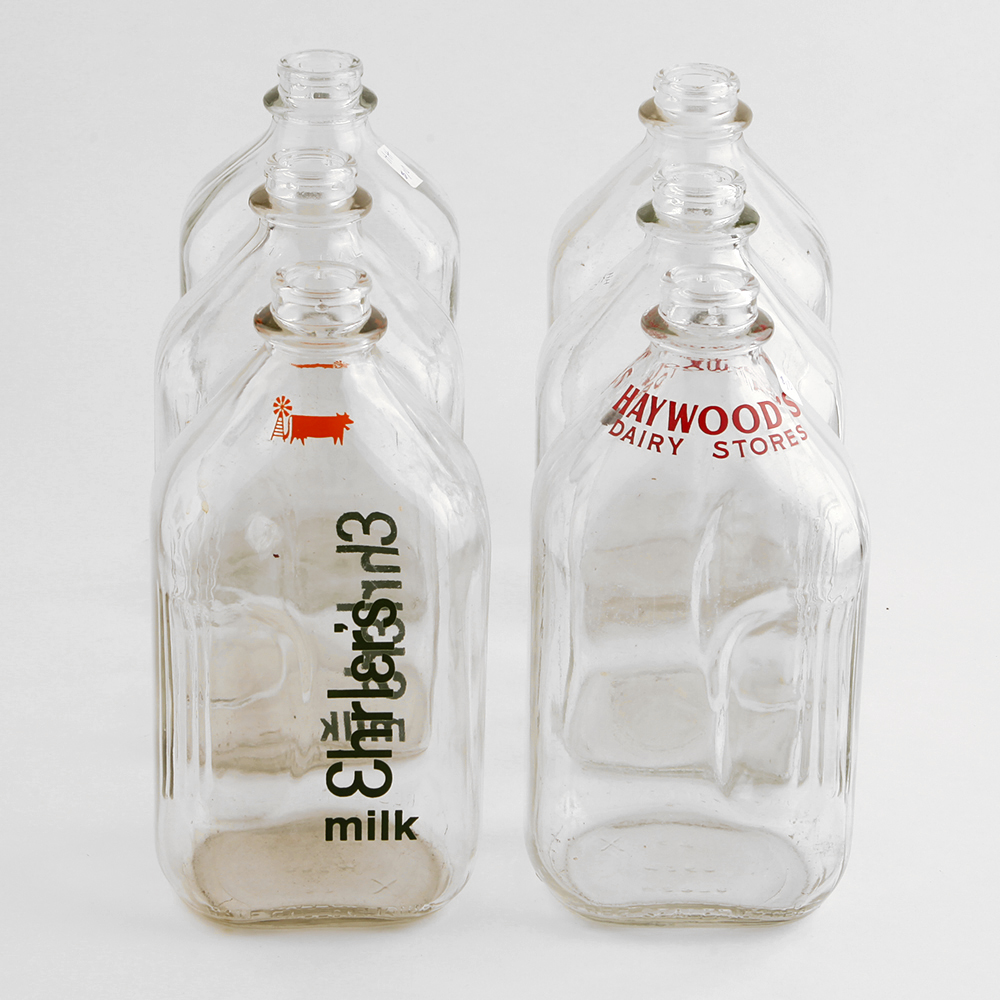 Six Half-Gallon Glass Milk Bottles