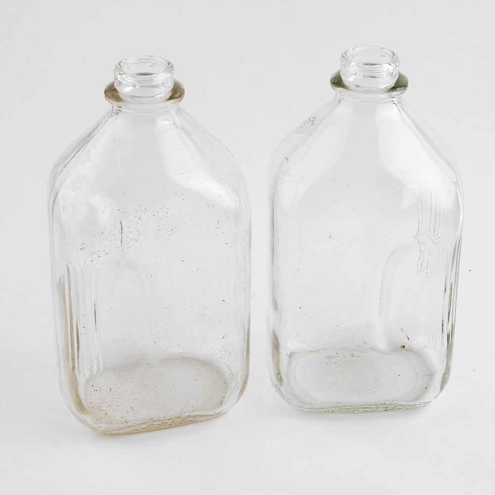 Six Half-Gallon Glass Milk Bottles