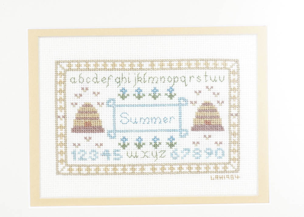 Hand-Stitched Seasons Cross Stitch