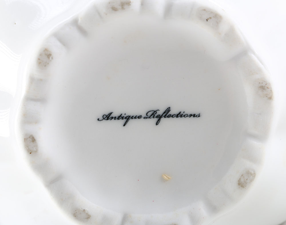 Set of Three Decorative Porcelain Pitchers