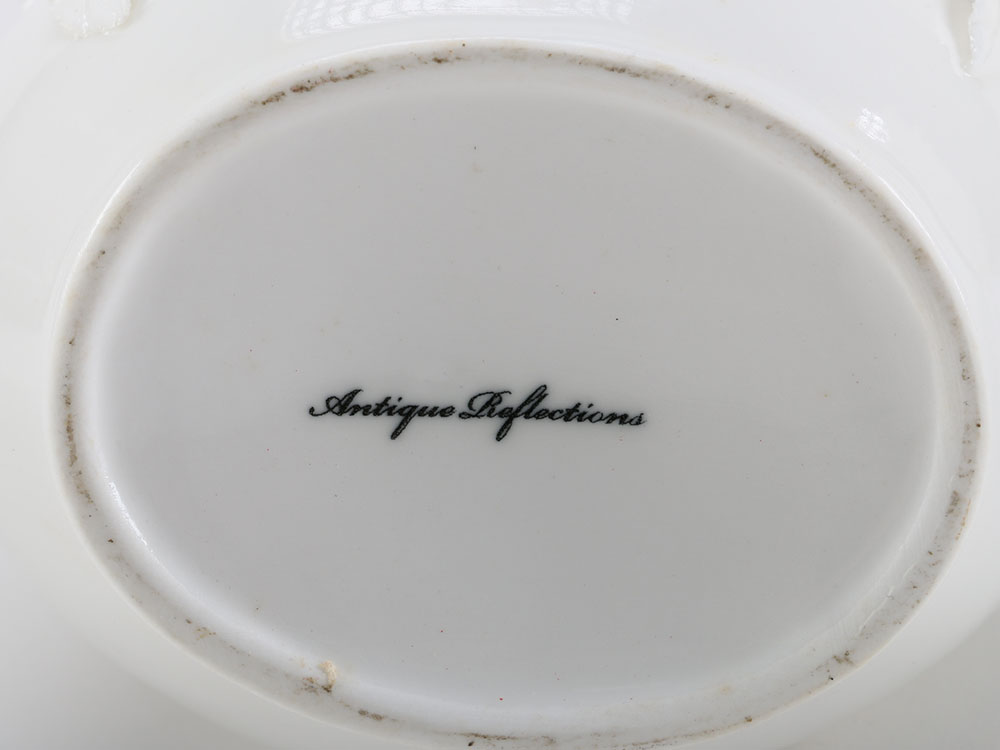 Set of Three Decorative Porcelain Pitchers